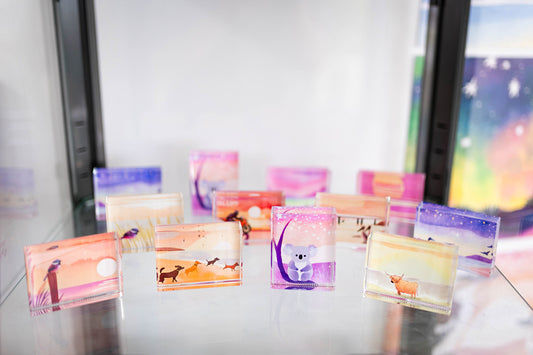 Twinkling Sunset Penguins: Glass Art Paperweight